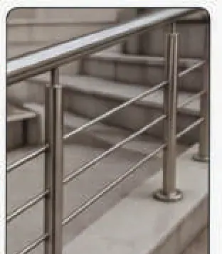 Stainless steel handrail fixed to a concrete floor